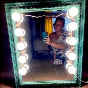 Vintage teal mirror with vanity lights attached